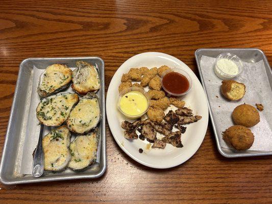 Alligator and Oysters On The Half Shell with hush puppies