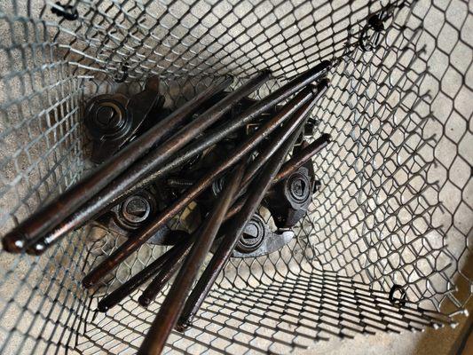 Pushrods and rocker arms getting ready to go into the parts washer.