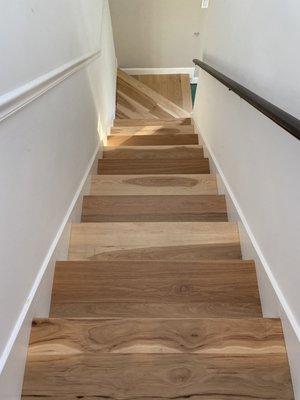 Hickory stairs, including custom work to create the bottom two stairs.