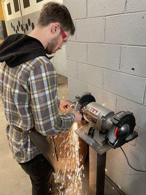 Kyle creating a finger guard for my knife