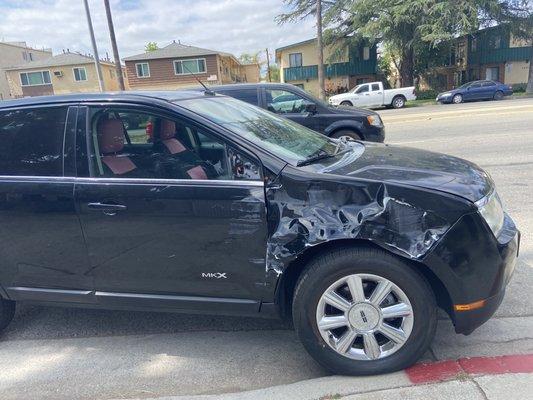 This is the car after the accident, the fender was so badly dented that I couldn't open my passenger side door