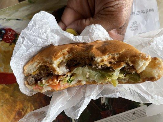 Partially eaten Cheeseburger after metal discovery