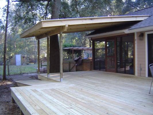 This is a custom deck we built for a client just west of Gainesville, Fl. It features a roof over half the structure and open...