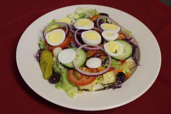 Our Garden Salad. Each salad is served with a side of dressing and Syrian bread.