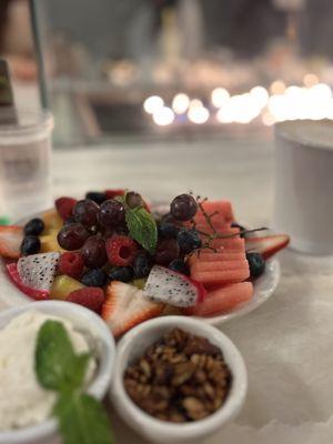 Half Fresh Fruit Plate with whipped cream and granola