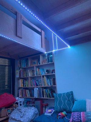 2 loft beds and built in bookcase.