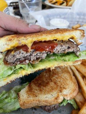 A grilled cheese with a patty in it. Very surprising and delicious!