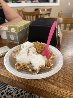 Ice cream on a waffle bowl.