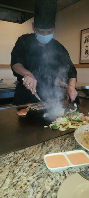 Chef creating delicious Hibachi dinner