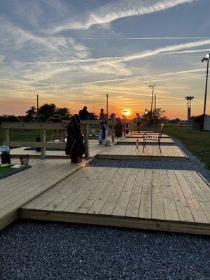 Sunset view. New decks and benches too. Evening sun in your eyes, unless you're a lefty.