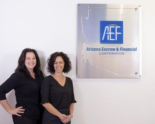 Our CEO Monica and President Annette with the AEF sign in our office building