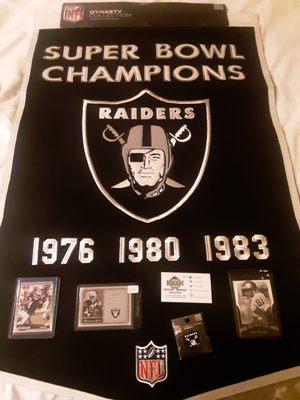 A Raiders championship pennant, three Raiders cards(Tim Brown,Bo Jackson,Jerry Rice),and a Raiders pin.