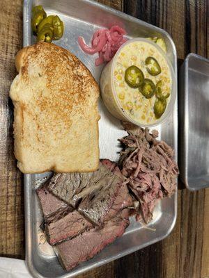 Brisket and pulled pork plate with jalapeño corn