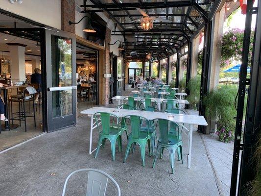 Outdoor tables with view of TVs to watch the game