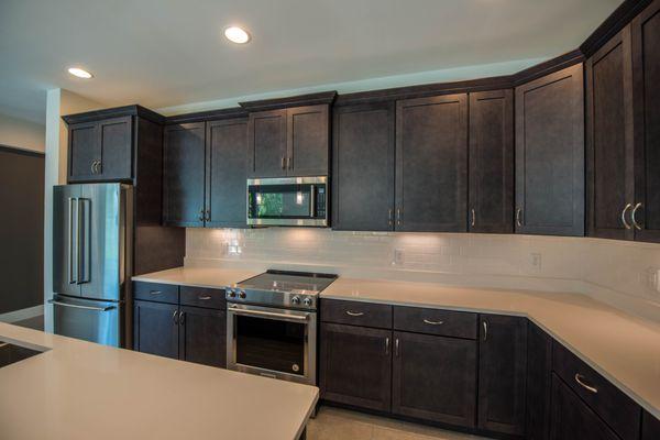 Quartz countertops with Kitchen appliance and custom wood cabinets