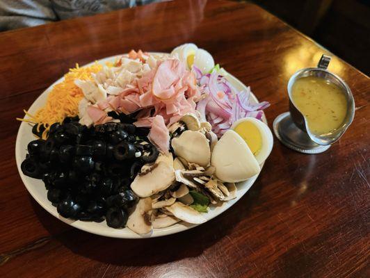 Chef's salad with extra eggs and olives