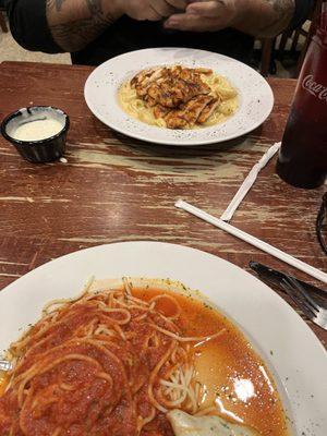 My chicken parm and tortellini in pink sauce with grilled chicken across the way