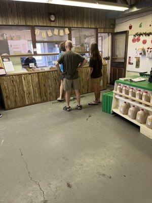 Donut stand/line, and the main counter where you pay for fruit is on the right