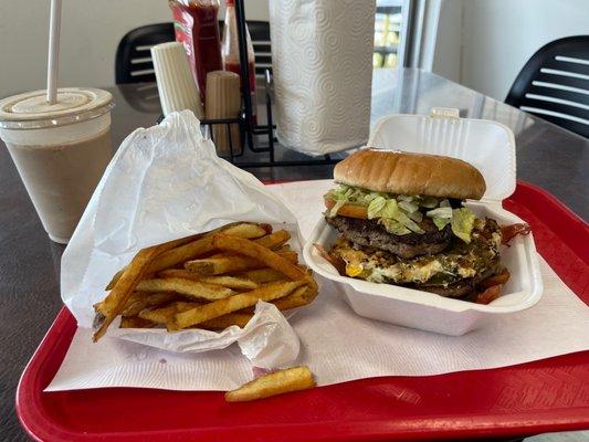 Triple meat, fried eggs, bacon, grilled jalapeños, fries, Chocolate malt.