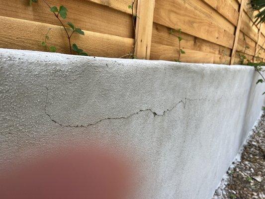 Crack in new retaining wall.