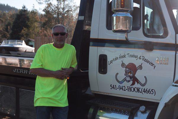 Captain James, with THE CAPTAIN Tow Truck, and a Beautiful Blue Sky