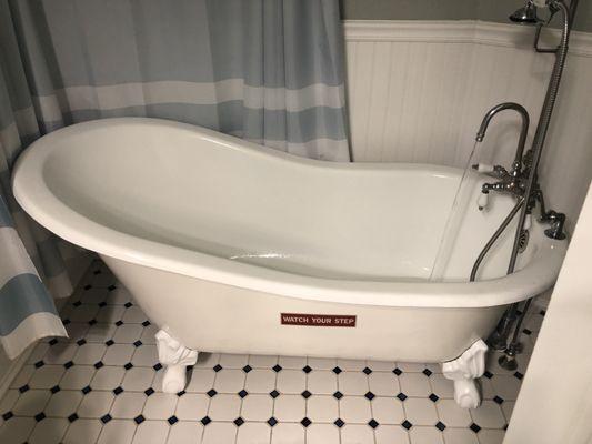 Claw foot tub in French room