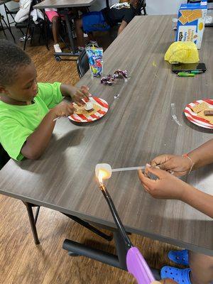 S'mores anyone? Camp kids enjoy s'mores.