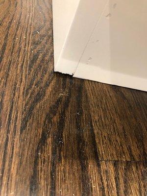 Base of cabinet where it meets the floor.