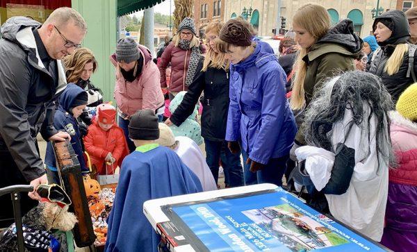 Dr. Wood passing out candy to trick or treaters at Antioch's Treat the Streets 2018