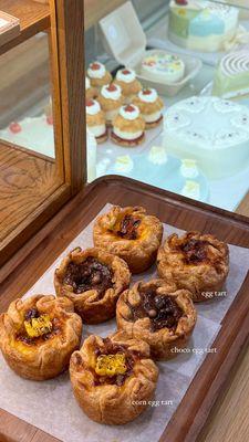 Corn egg tart, chocolate egg tart, egg tart