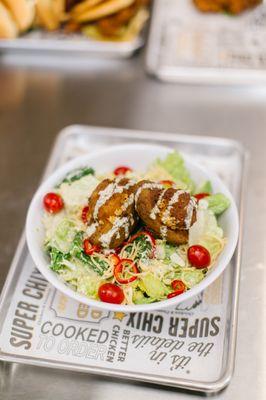 The Crispy Avocado, a vegetarian friendly option. Topped with Fresno peppers, tomatoes, gouda, and a yummy tomatillo dressing.