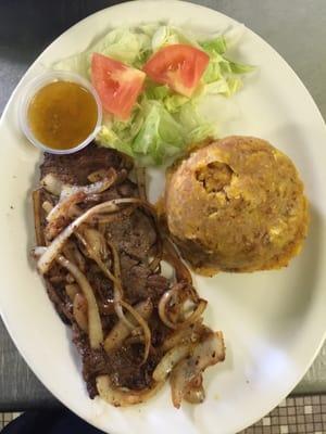 Mofongo with steak sautéed with onions. And more come visit us!! Good food, good price!!