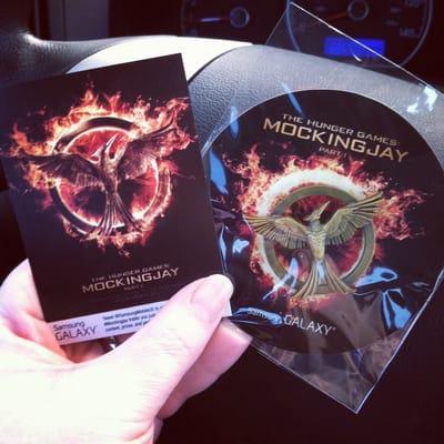 Free movie ticket and Mocking jay pin from the "Samsung Experience" workers.