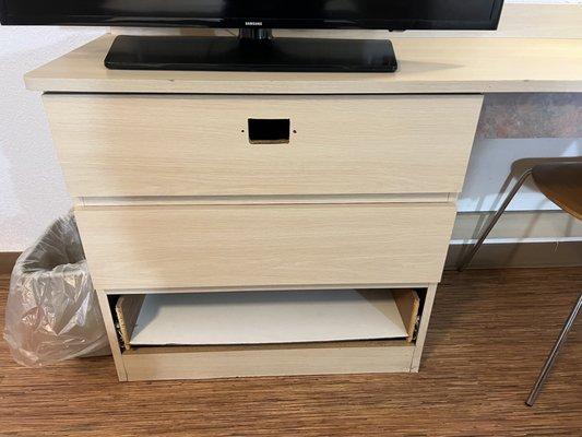 Tv stand, hole where drawer pull should be, missing bottom drawer