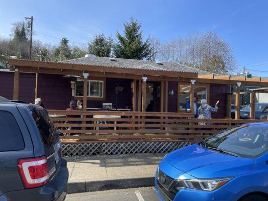 Cute new location has deck seating in front, picnic tables in back.