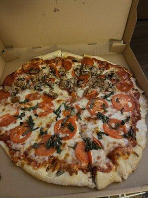 Half and half pizza of a custom combo and margarita pizza