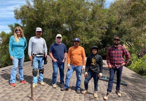 Ok let's get a picture with everyone. Isn't that a beautiful roof we're standing on? You bet it is.