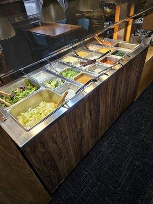 The other side of the salad bar. A really good variety of salad dressings! Yum!