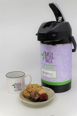 Coffee in returnable stainless steel pump and assorted cookies and brownies