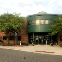 Summer view of the entrance from the back of the building.