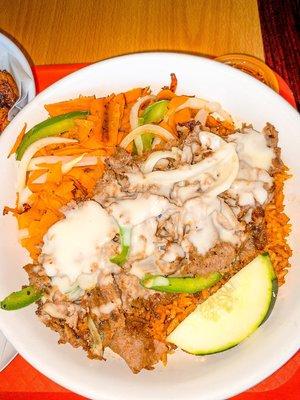 Jollof Rice with Cheesesteak (I got it in spicy and this is a large order)