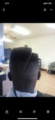 High Top bald fade with step and part.