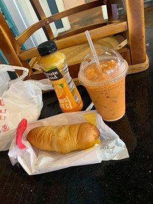 Jumbo Sausage with Cheese Kolache, orange Juice, and Thai ice tea