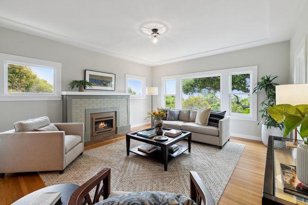 This room was transformed with new colors, new lighting and new glass tiles on the fireplace!