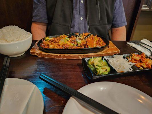 Dakgalbi with white rice, sided of kimchi, pickled radish and zucchini