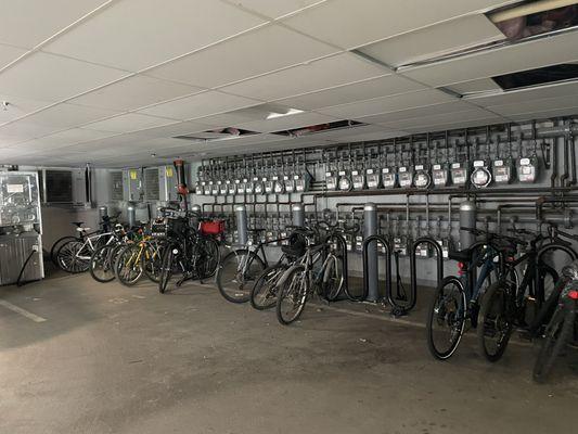 Bike under broken ceiling. Washer and dryer to the side