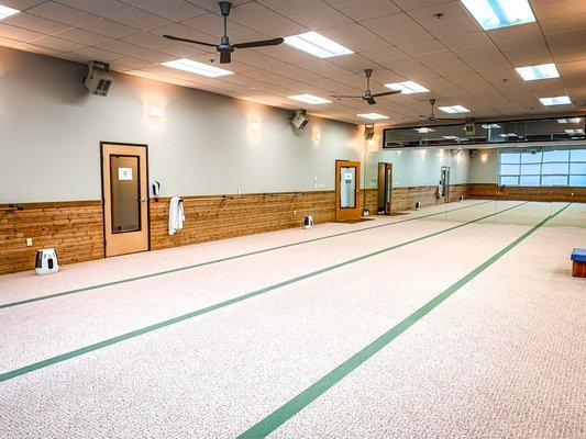 The Hot Room with exit and entrance door, and our beautiful cedar wall. Added door for increase room ventilation between classes.