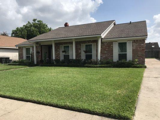 New roof replacement with using laminate 30 yr compositions shingles w. wood color .