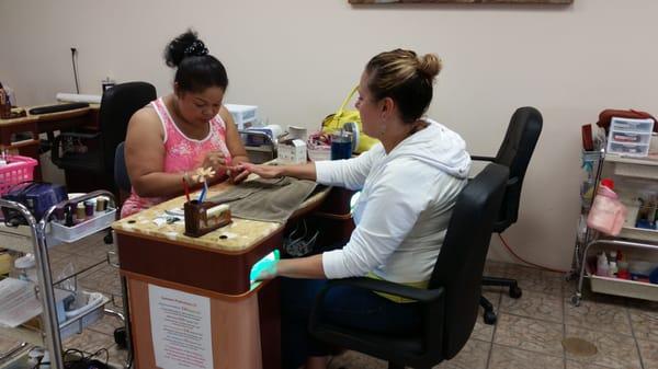 Led gel light installed on the nail stations,  very convenient