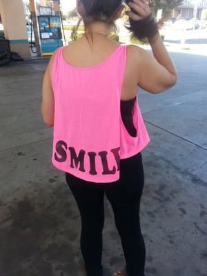 Smile, her shirt says. It's contagious!